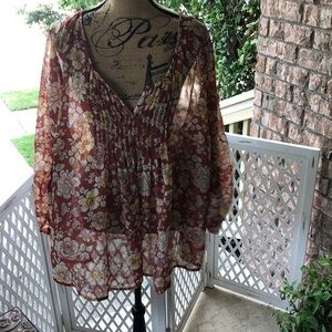 Brown and beige floral print sheer blouse.